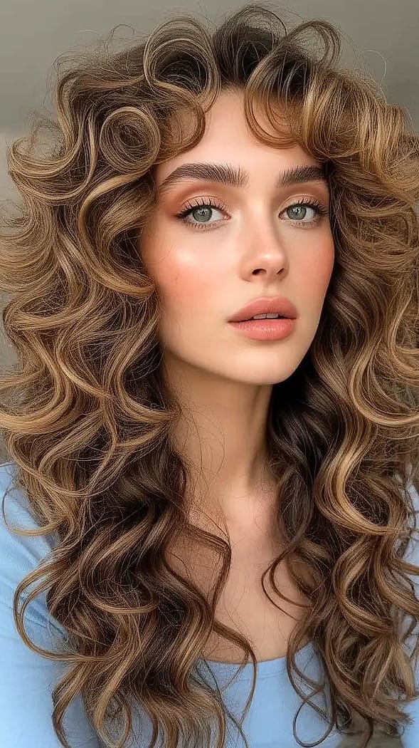 25 Cute Hairstyles For Medium Hair Curly Perfect for Your Next Salon Appointment 24 Big Bouncy Curls