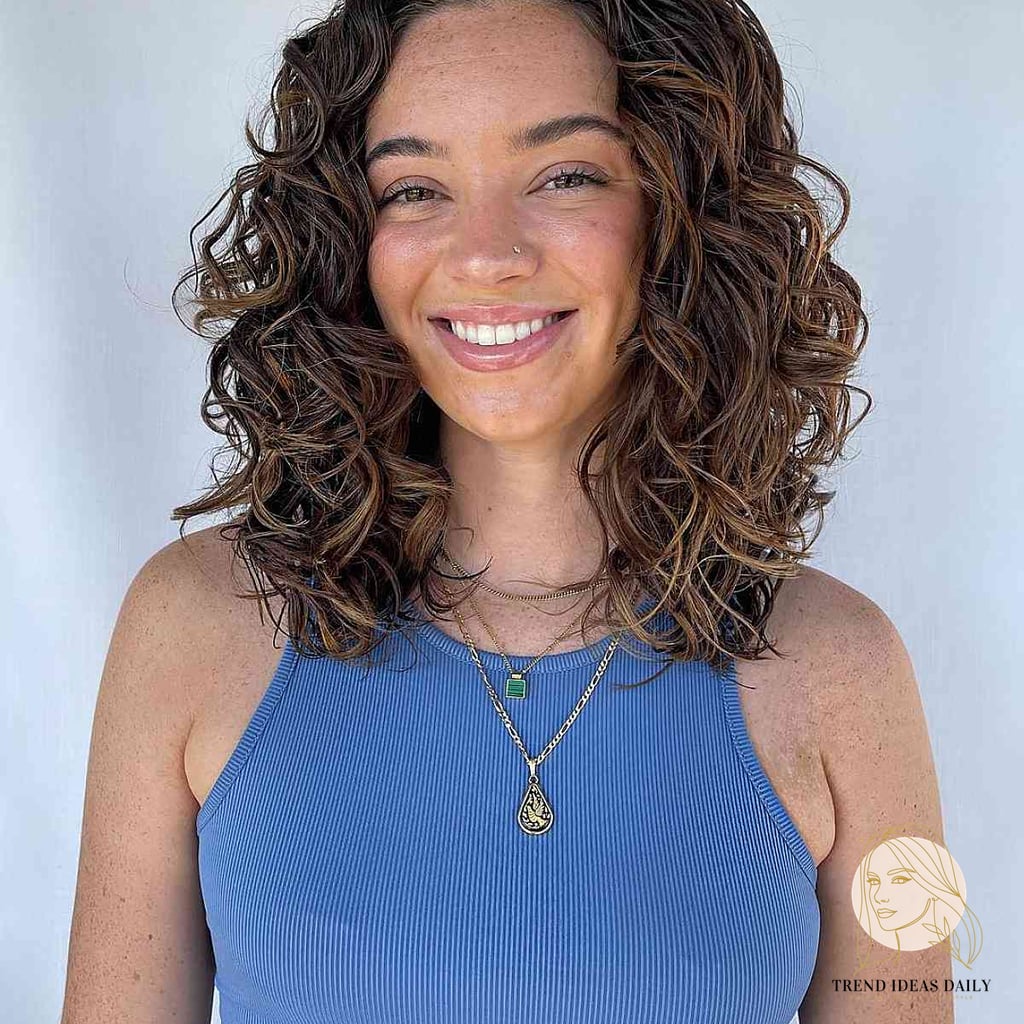 10 Stunning Hairstyles For Medium Length Curly Hair Worth Bookmarking Today 7 Cascading Curly Wavy Hair