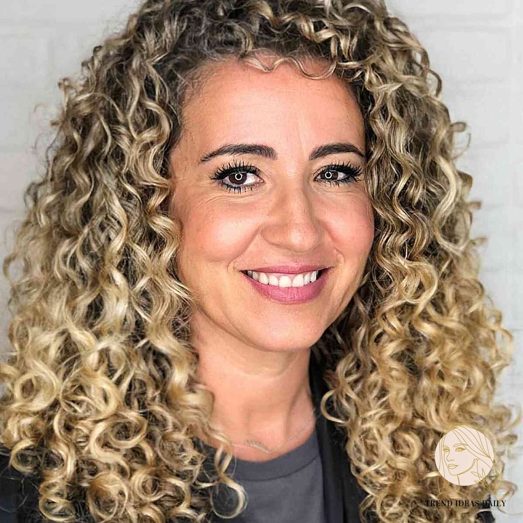 25 Cute Hairstyles For Medium Hair Curly Perfect for Your Next Salon Appointment 20 Defined Curls with Volume