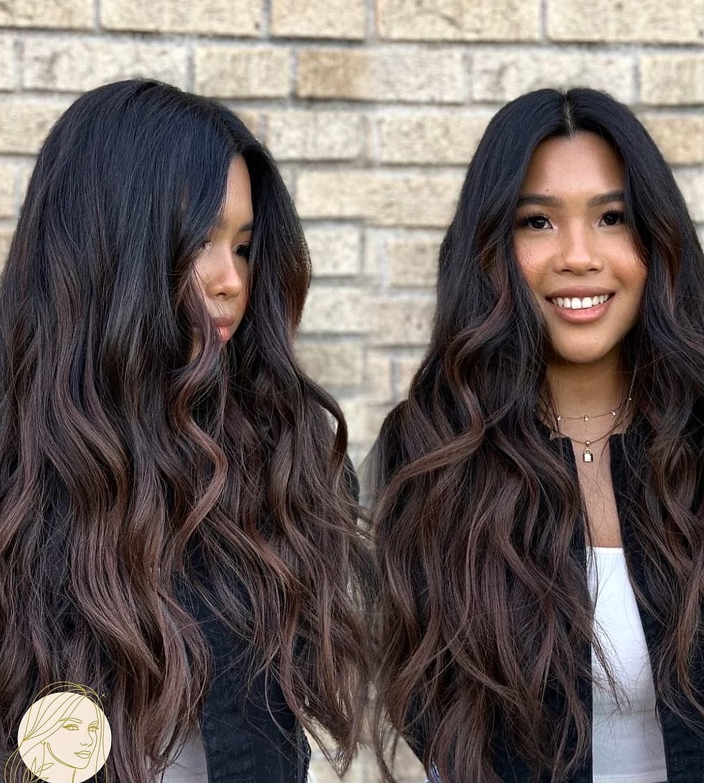 Layered Dark Brown Haircut With Soft Feathers Framing The Face