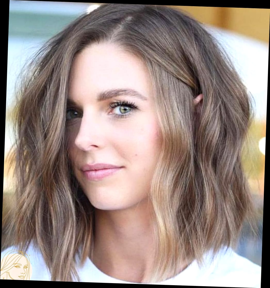 Medium Layered Haircut With Soft Waves Framing A Rich Brown Look