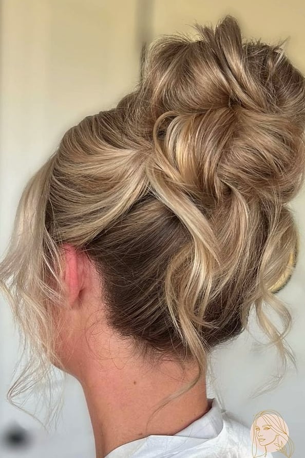 15 Glam Hairstyles For Short Hair Everyone Is Pinning Right Now 8 Messy Bun on Short Hair
