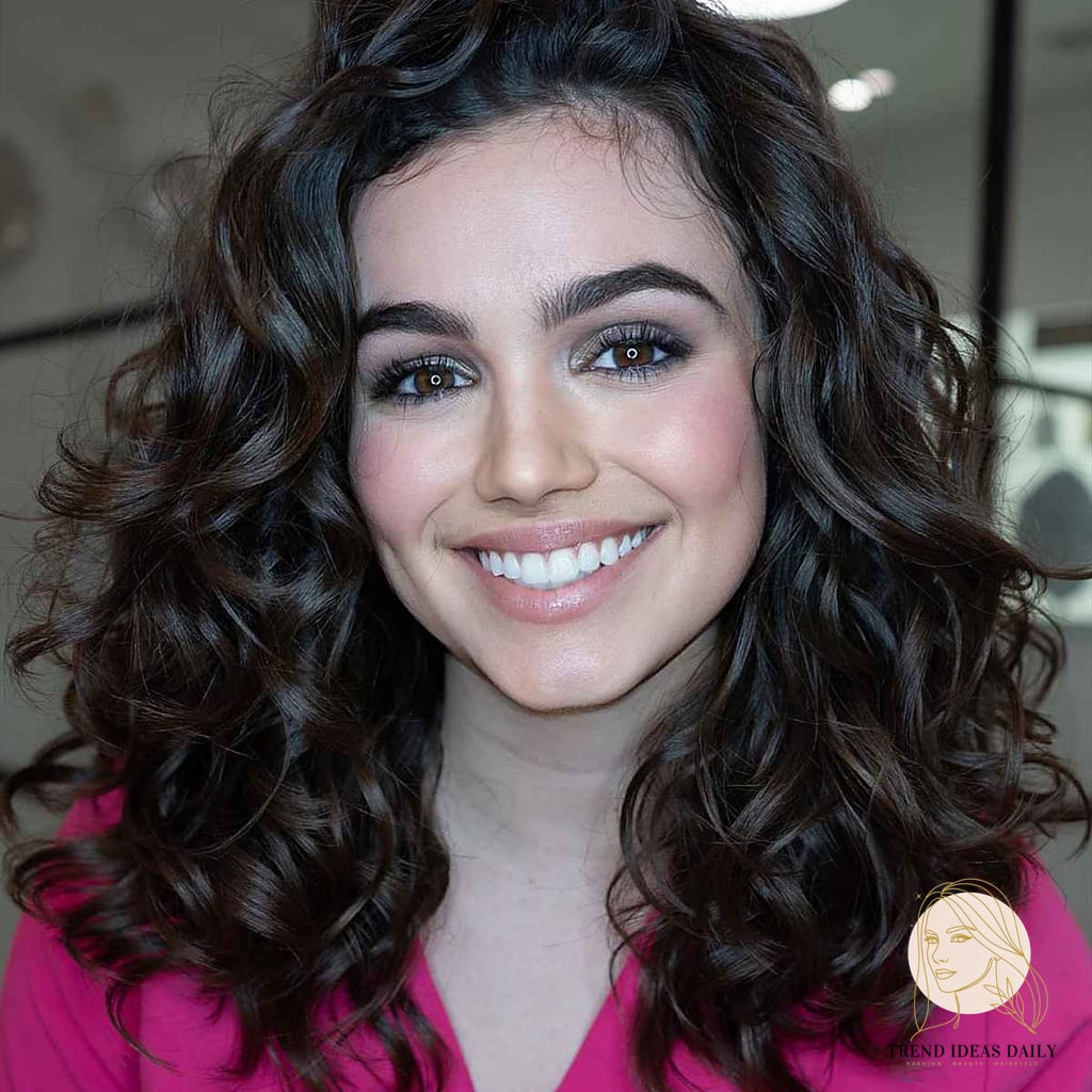 25 Cute Hairstyles For Medium Hair Curly Perfect for Your Next Salon Appointment 3 Natural Curls with a Side Part