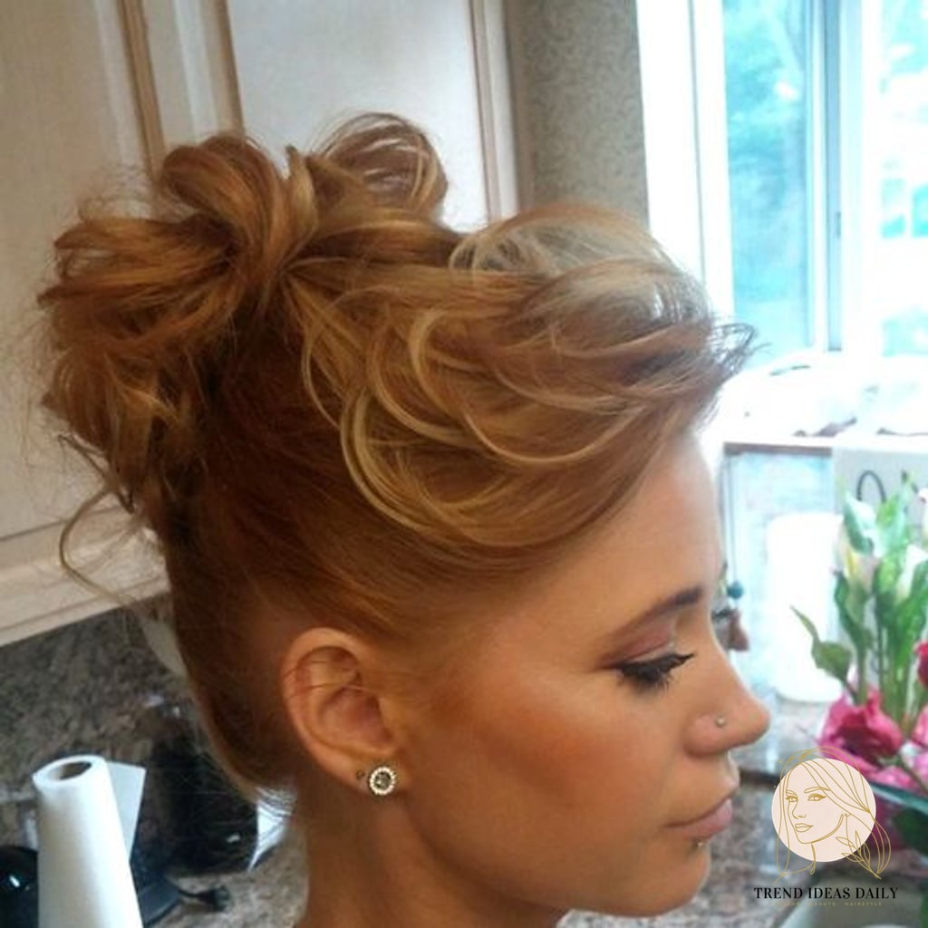 9 Bun Hairstyles Short Hair We're Obsessed With Right Now 7 Voluminous Bun with Teased Bangs